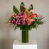 Bright, exotic color and lush texture make this tropical arrangement a show-stopping