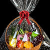 Gift basket of assorted fruit wrapped in clear cellophane with a red bow