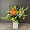 Our Bee Happy arrangement features breezy blooms in shades of yellow, orange