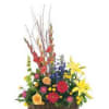 Colorful mixed flower arrangement in a wicker basket