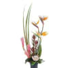 Tall tropical arrangement with bird of paradise and pink ginger in a dark vase