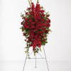 Tall red floral standing spray on an easel