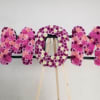 Floral letters spelling MOM in pink and purple flowers