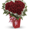 Red rose bouquet in a red box with a heart ribbon