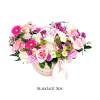 This arrangement has a soft, garden-inspired, romantic feel with delicate pinks, whites
