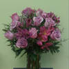 Pink roses and alstroemeria in a clear glass vase