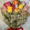 Bouquet of multicolored roses with baby's breath wrapped in clear plastic