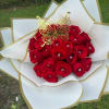 Red rose bouquet with a gold butterfly topper and white-gold wrapping