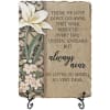Decorative memorial plaque with white flowers and a sympathy quote