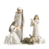 Nativity figurines of Mary, Joseph, baby Jesus, and sheep