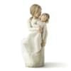 Carved figurine of a woman holding a child