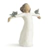 Wooden angel figurine with outstretched arms and small bird accents