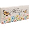 Decorative memorial plaque with butterflies and pastel flowers