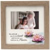 Wooden photo frame with a memorial quote and pink lotus flowers