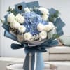 Blue and white bouquet with roses and hydrangea wrapped in blue paper