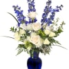 Blue and white floral arrangement in a cobalt vase