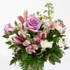 Lavender roses and pink alstroemeria in a mixed bouquet