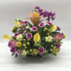 A tropical-inspired arrangement featuring premium orchids, elegant calla lilies, carnations, a striking
