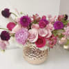 Pink and purple mixed bouquet in a textured glass vase