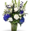 Blue Elegance is a graceful arrangement designed in a clear glass vase