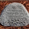 Memorial stone engraved for a beloved pet in mulch