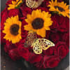 Red roses with yellow sunflowers and gold butterfly decorations