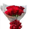 Bouquet of red roses wrapped in translucent paper with a red ribbon bow