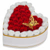 Heart-shaped box of red and white roses with a gold butterfly topper