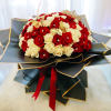 Bouquet of red and white roses with gold butterfly accents