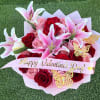 Bouquet of red and pink roses with pink lilies and a Valentine ribbon