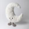 Plush crescent moon with a smiling face and small feet