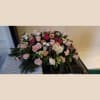 Large pink and white floral spray with roses and carnations