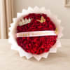 Red rose bouquet with a birthday ribbon and decorative crown