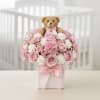 Pink rose arrangement with a teddy bear in a white box