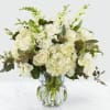 White floral bouquet in a clear glass vase