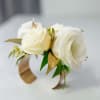 Modern, sleek gold metal cuff makes a quietly glamorous wrist corsage. 
