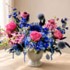 Bright, lively color pops of vivid blue and soft pink make this