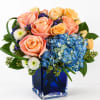 A cheerful, modern bouquet that pops with color - peach roses and