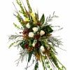 A large, upright standing spray that makes a respectful, woodsy statement for
