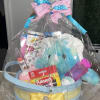 Gift basket with plush toys and crayons wrapped in clear plastic