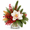 White orchid arrangement with red berries in a clear glass vase