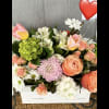 Mixed bouquet in a white box with pink roses, tulips, and white daisies