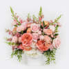 Overflowing with rich coral, blush, and soft peach blooms, Coral Crush is