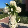 Tall white floral standing spray with roses and calla lilies