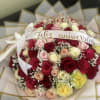 Bouquet of multicolored roses with a "Feliz aniversario" ribbon