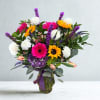 Bright, cheerful, and full of personality, this vibrant arrangement is designed to