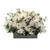 White floral arrangement in a rectangular gray container