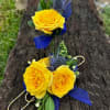 Yellow rose corsage and boutonniere with blue ribbon accents
