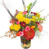 Colorful bouquet of yellow roses, red mums, and pink carnations in a painted vase