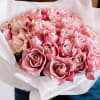 12 beautiful roses are artfully arranged in this handcrafted bouquet and wrapped